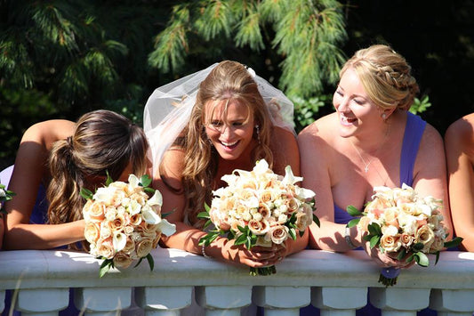 three Bridesmaid holding bridal bouquet