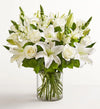 Classic All White Arrangement, Bouquet of white flowers in a clear vase on a white background