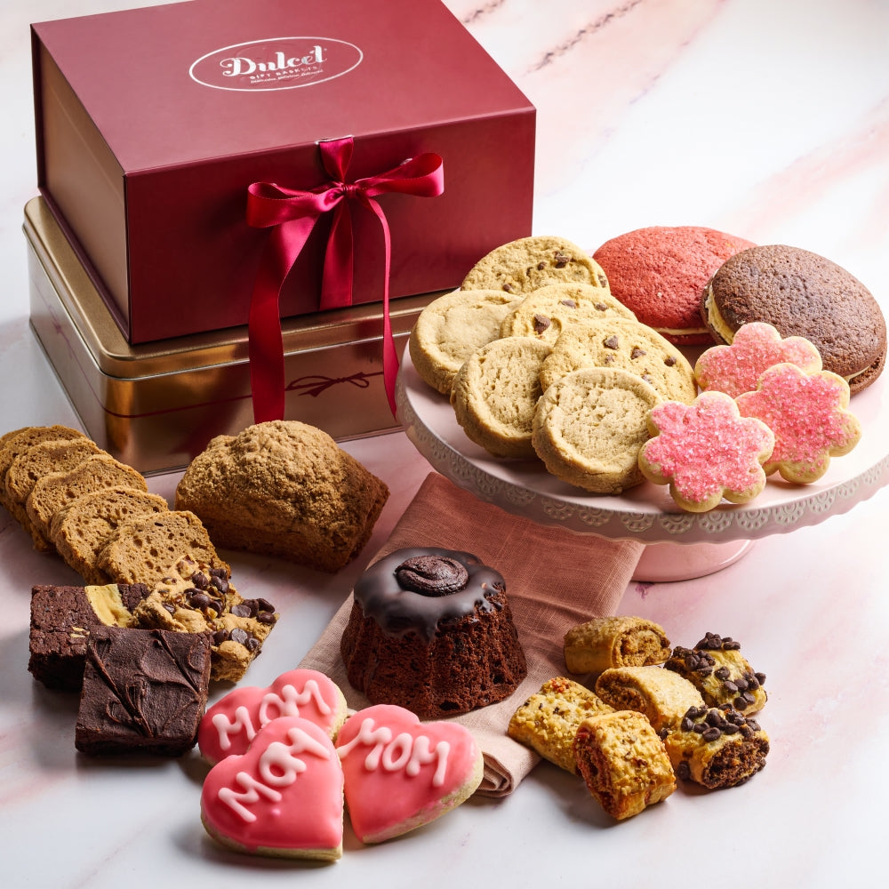 Assorted cookies on a marble surface with a Dulced box in the background