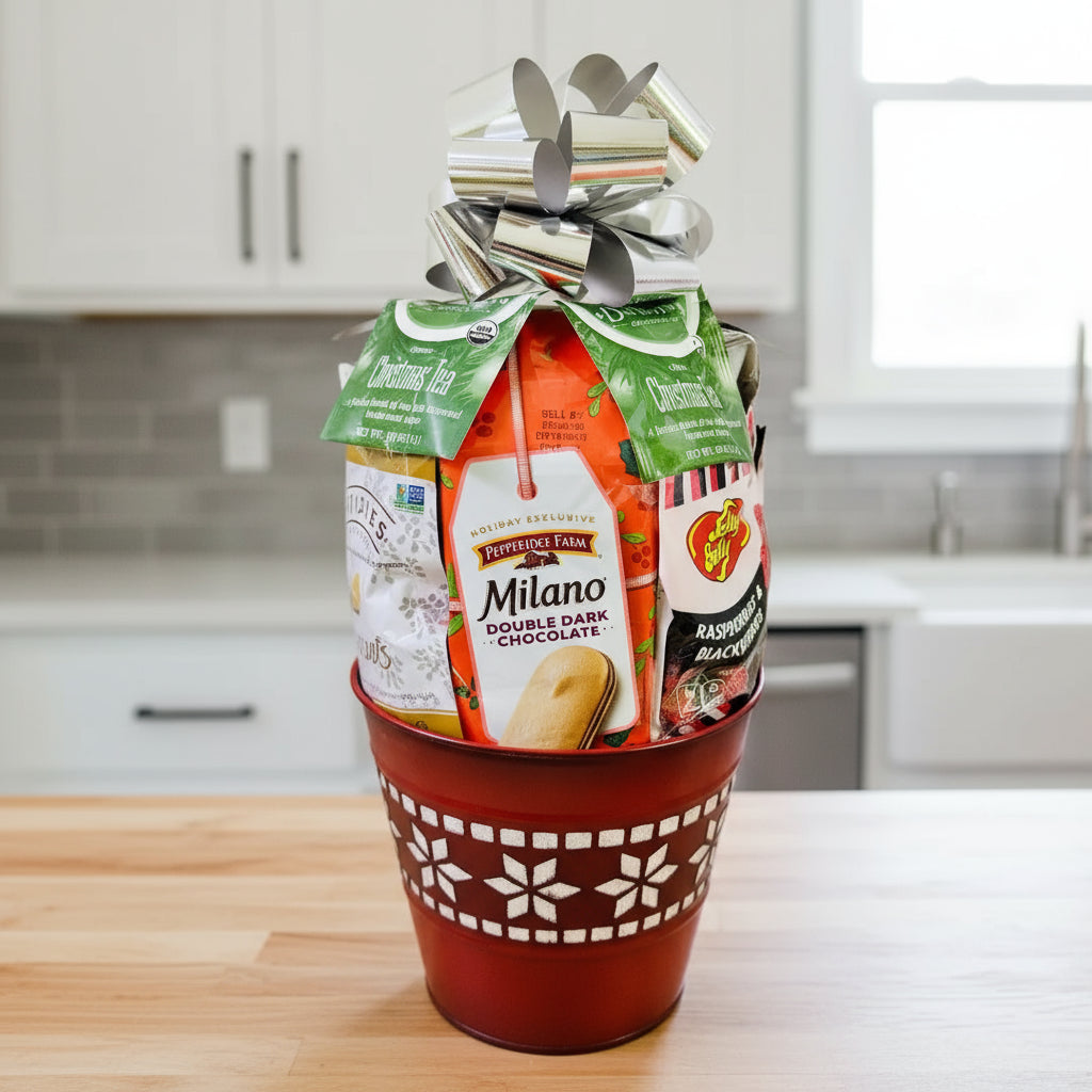 Festive gift basket with snacks in a decorative holiday pot on a wooden counter.