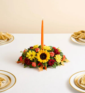 Fields of Europe for Fall Centerpiece, Colorful floral arrangement with a candle on a white tablecloth