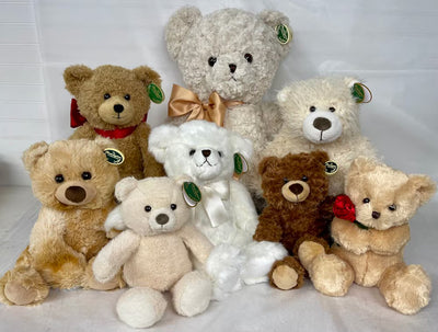 Group of stuffed teddy bears with various colors and accessories on a white background Group of stuffed teddy bears with various colors and accessories on a white background