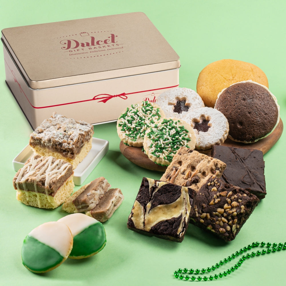 Assorted cookies in front of a 'Dulce' gift box on a green background