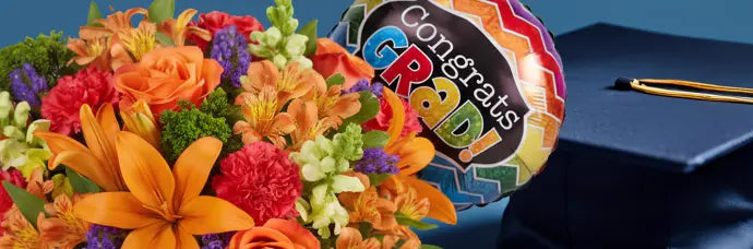 Bright graduation flower arrangement with festive “Congrats Grad” balloon from James Cress Florist, designed to celebrate achievements with colorful seasonal flowers.
