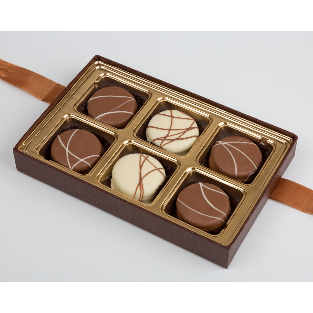 Box of chocolates with a brown and gold design on a white background