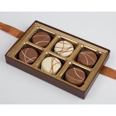 Box of chocolates with a brown and gold design on a white background