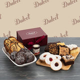 Assorted desserts on a wooden board with a 'Dulce' box in the background