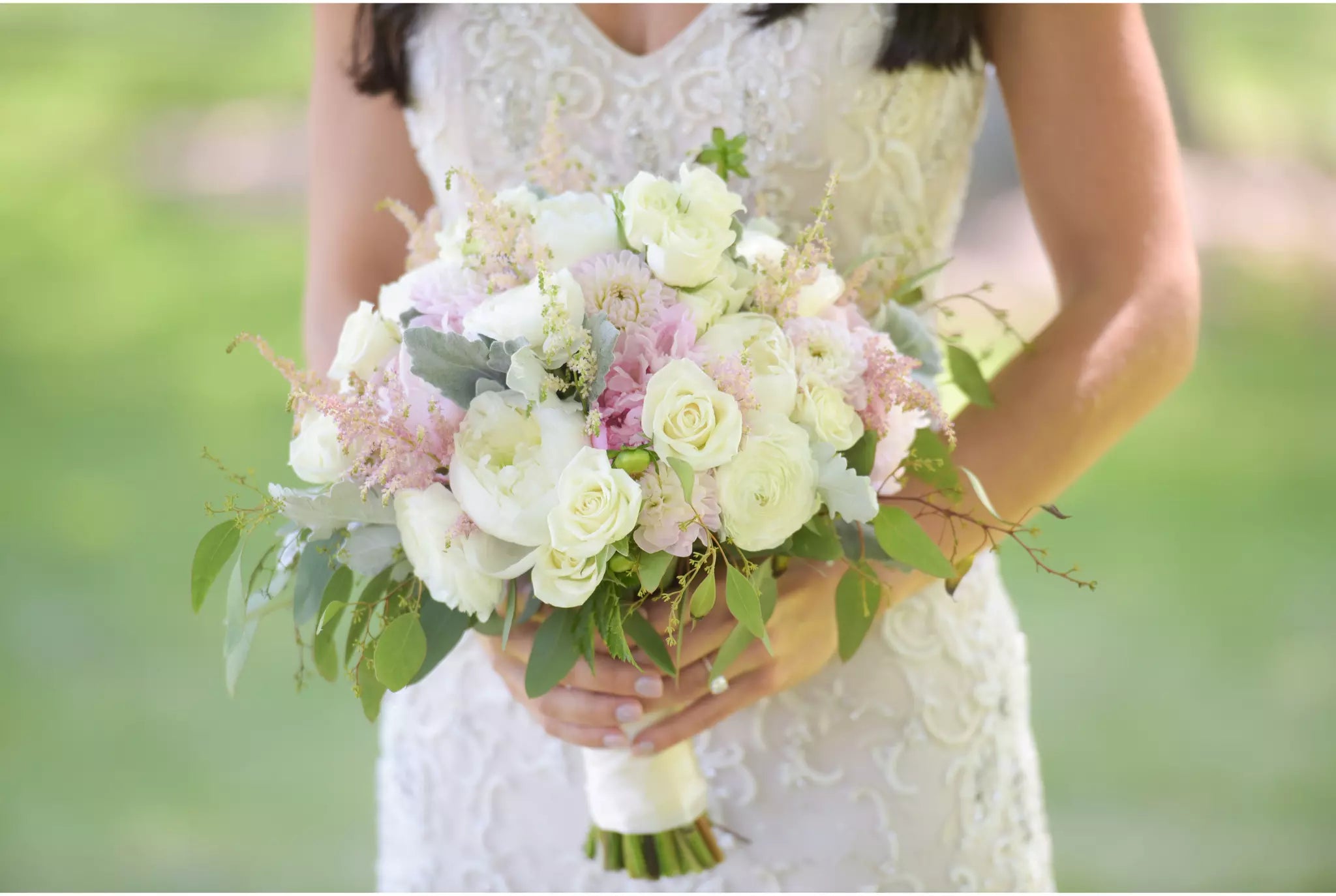white bridal bouquet with white roses white listentis stems white bouquet