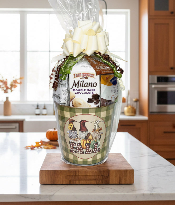 Gift basket with Milano chocolate and autumn leaves on a wooden surface.