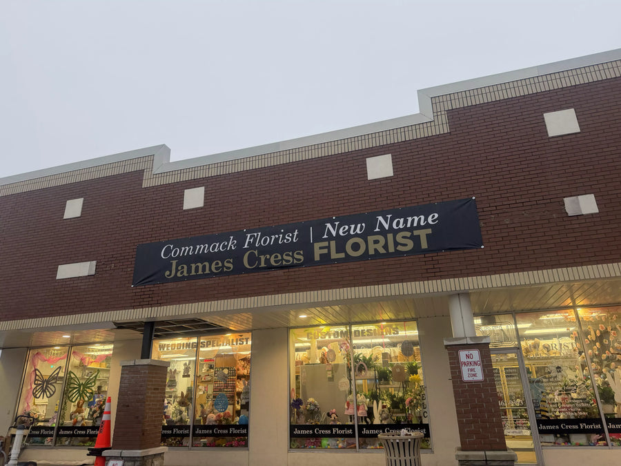 Front exterior of James Cress Florist in Commack, NY, featuring a brick storefront with a banner reading Commack Florist | New Name James Cress Florist and large display windows showcasing floral arrangements and gifts.