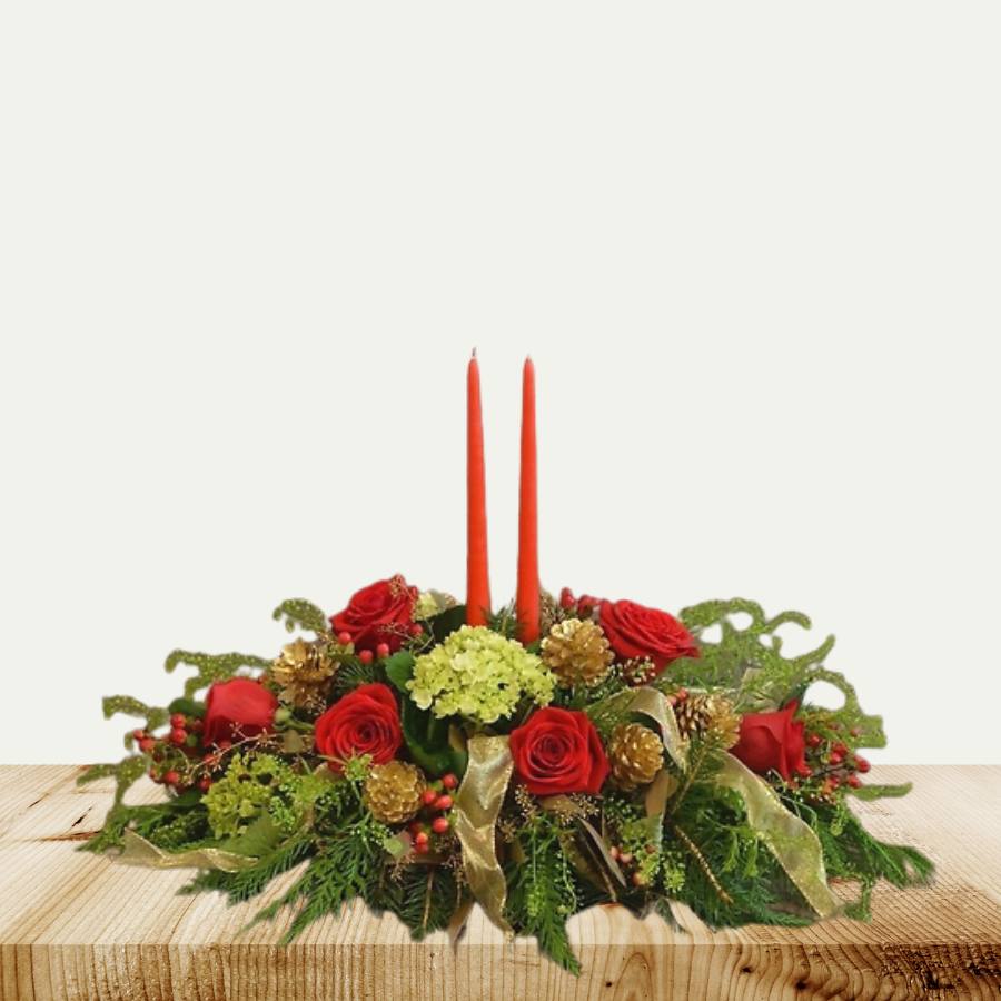 Festive candle arrangement with boxwood greens and lantern candles